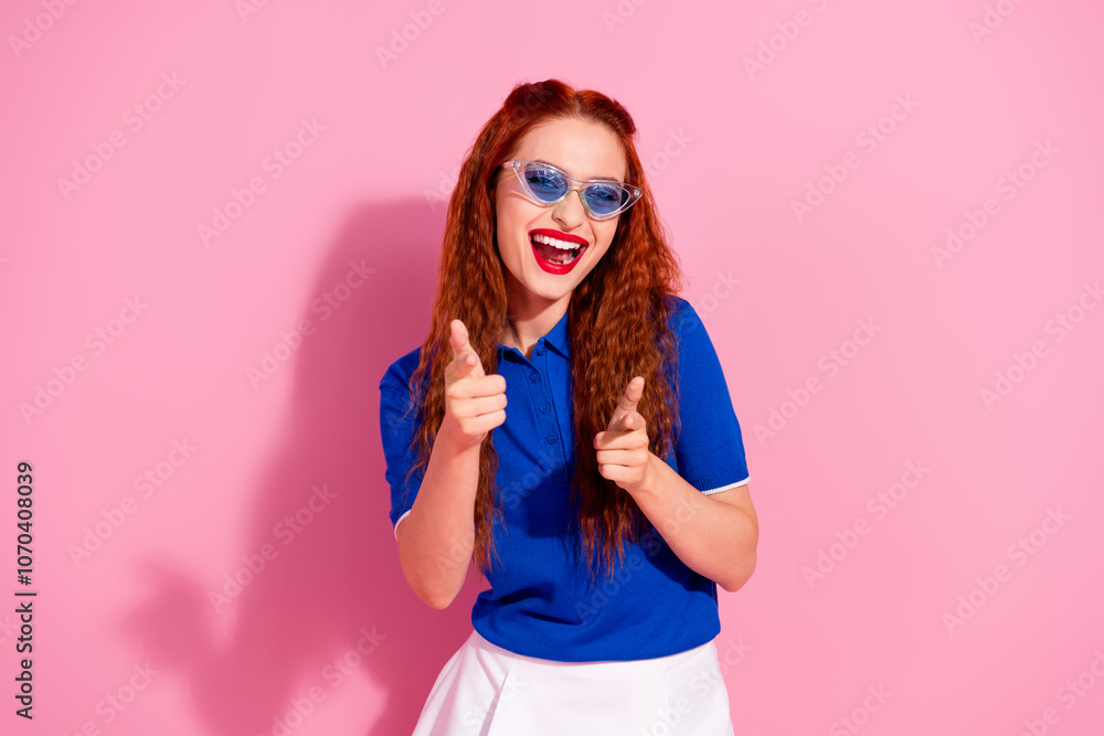 Photo of adorable lovely woman wear blue stylish clothes look camera isolated on pink color background Photo of adorable lovely woman wear blue stylish clothes look camera isolated on pink color background