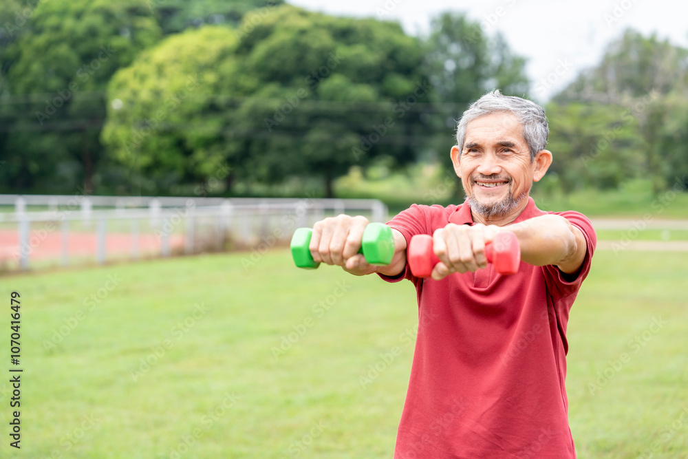 active senior man doing exercise with dumbbell outdoors in the nature park,elderly lifestyle,workout activity,health benefit in nature active senior man doing exercise with dumbbell outdoors in the nature park,elderly lifestyle,workout activity,health benefit in nature