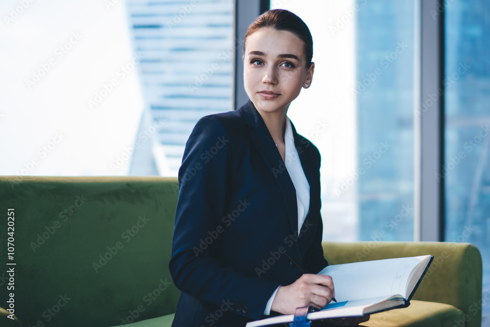 Pensive businesswoman writing notes at table Pensive businesswoman writing notes at table