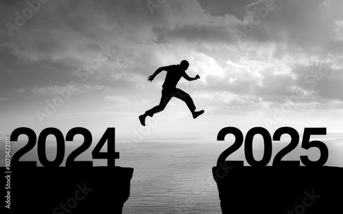 Happy new year 2025, Silhouette Man jumping from 2024 cliff to 2025 cliff on sky background. Сoncept of moving from year to year. New Year's concept.