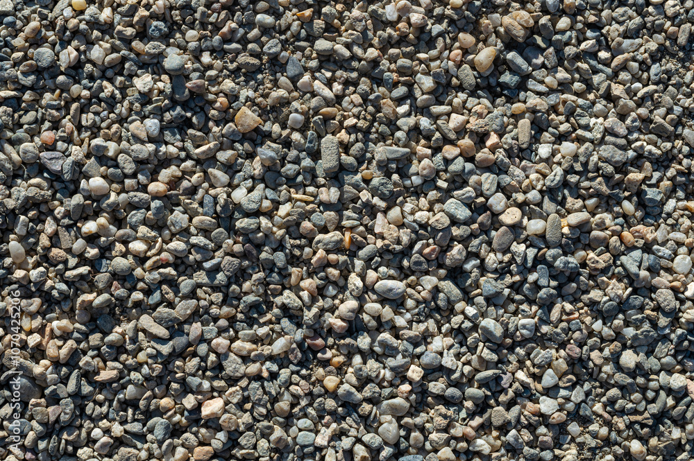 Background with texture of pebbles, small gravel raw material in the manufacture of concrete. Background with texture of pebbles, small gravel raw material in the manufacture of concrete.