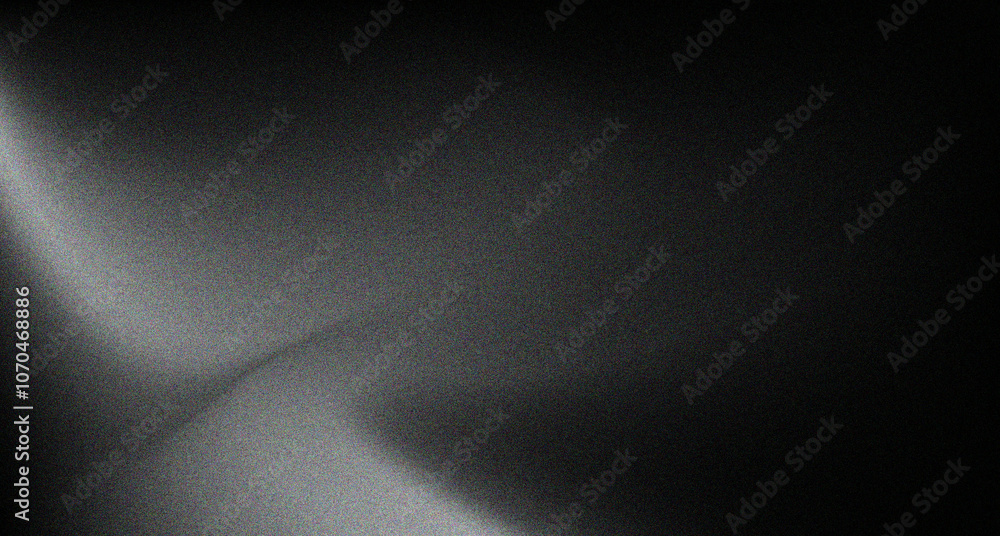 Black and grey gradient background with a grainy texture for wallpaper or web banner Black and grey gradient background with a grainy texture for wallpaper or web banner