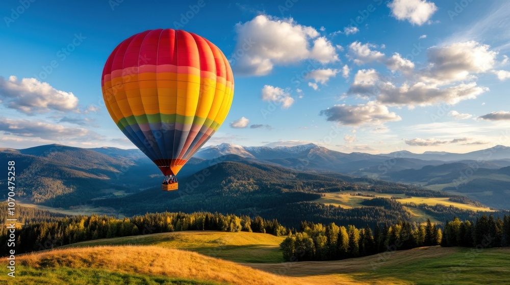 Naklejka premium Vibrant Hot Air Balloon Over Scenic Landscape