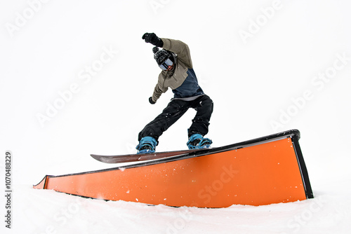 Gravity defying snowboarder. Balancing and tricks on the wallride descent. photo