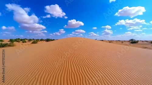 Desert Sand Dunes Landscape with Blue Sky and Clouds