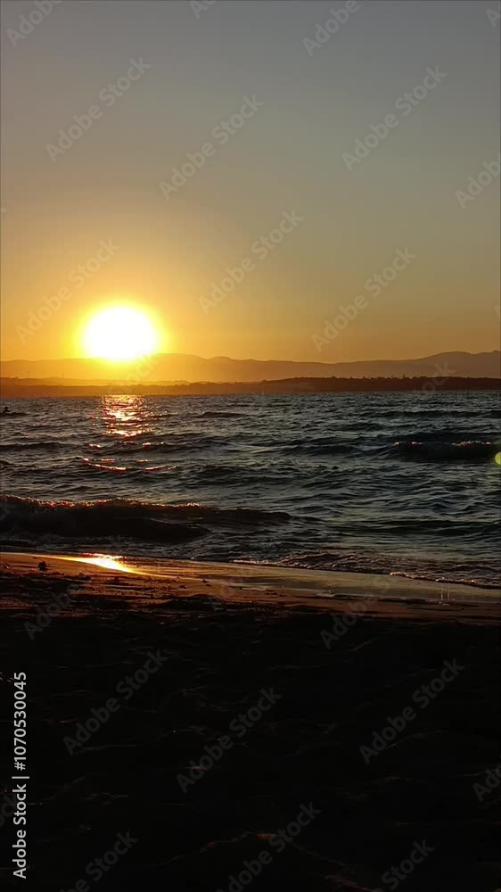 waves crashing on the beach at sunset waves crashing on the beach at sunset