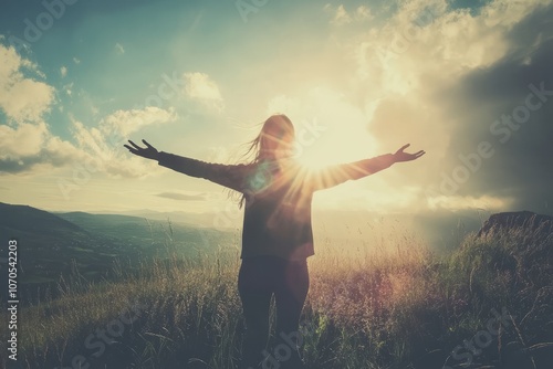 silhouette of a person opening his arms wide in the nature photo