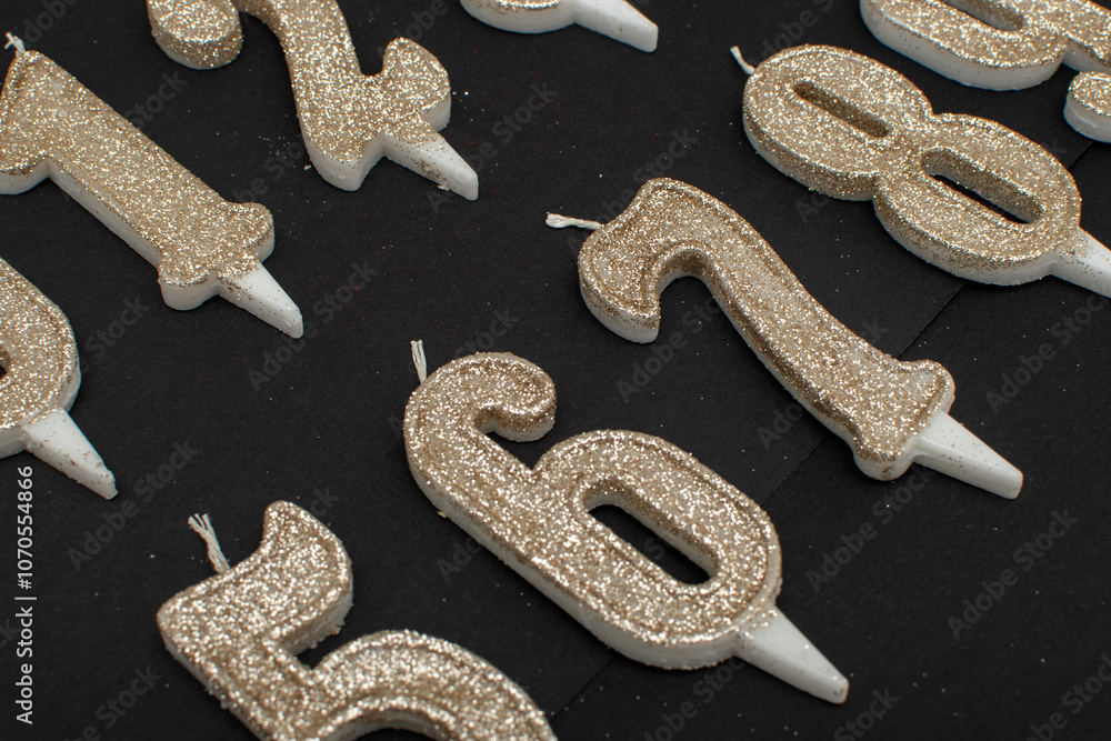 Birthday numeral candles on black background Birthday numeral candles on black background