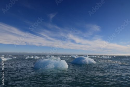 Iceberg drifting in the sea in front of the Austofonna Ice Cap photo