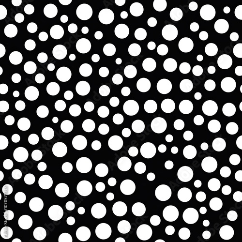 A Black Background with White Circles of Varying Sizes