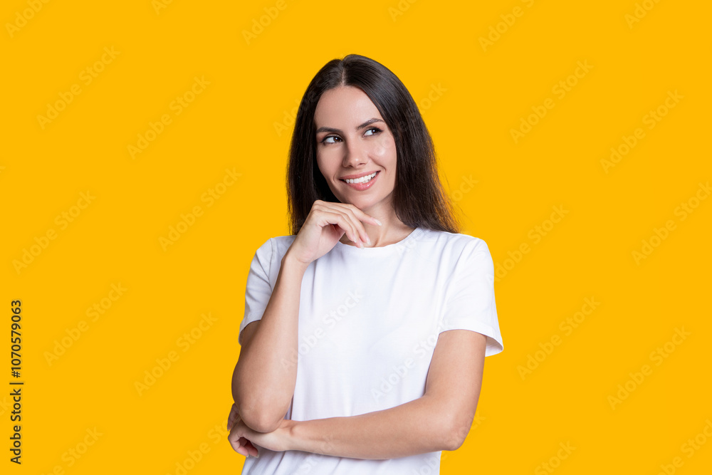 Female casual style. Portrait of millennial girl. Caucasian millennial girl. Woman in white tshirt isolated on yellow. Smiling young woman with brunette hair. Stylish female. Minimalist portrait Female casual style. Portrait of millennial girl. Caucasian millennial girl. Woman in white tshirt isolated on yellow. Smiling young woman with brunette hair. Stylish female. Minimalist portrait