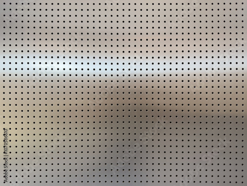 Close-up of Perforated Metallic Surface - Detailed Industrial Texture
