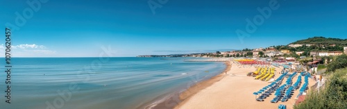 A panoramic view of Senigallia’s sandy beaches and vibrant umbrellas along the tranquil Adriatic Sea under a clear blue sky