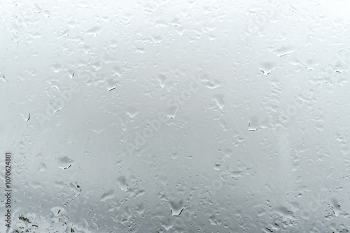 Raindrops on window glass. Rainy weather.