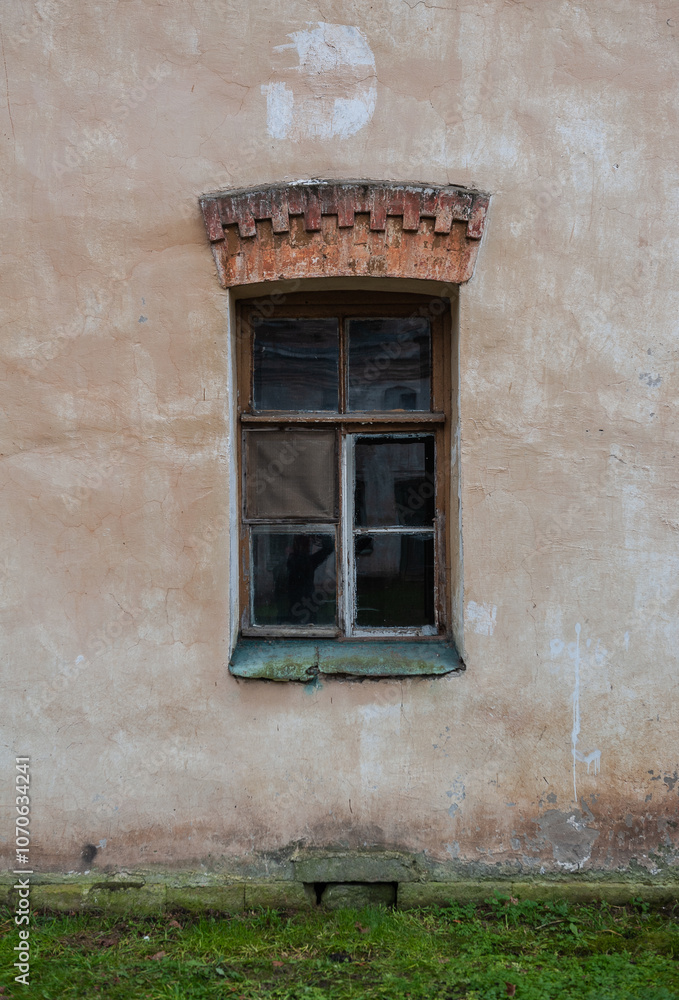 Old wooden window on the ancient abandoned house Old wooden window on the ancient abandoned house