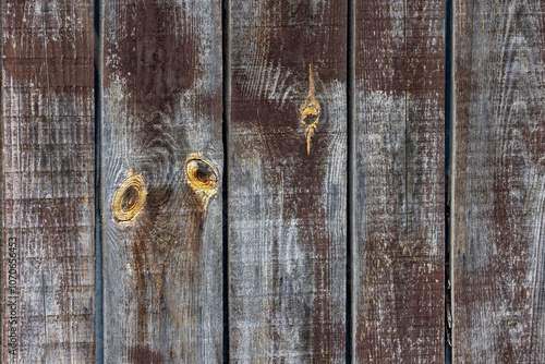 Weathered wooden planks showcasing unique knots and textures in natural light
