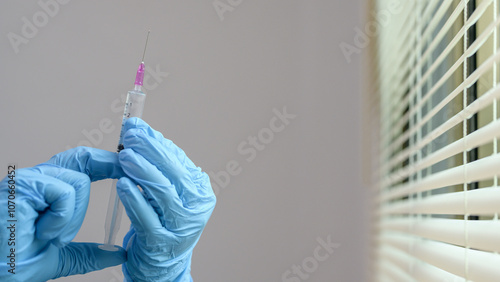 Close-Up of Doctor Holding Syringe in Hospital Setting