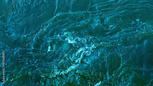 whitewater vortex from above, closeup top view of real wild river water texture, nature scene background for hydroenergy, sports or natural force photo