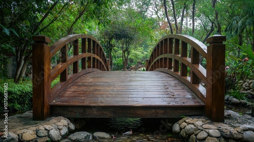 Wooden bridge in a lush garden, with a stream flowing underneath.