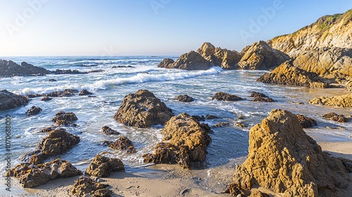 Rocky beach with waves crashing on shore.