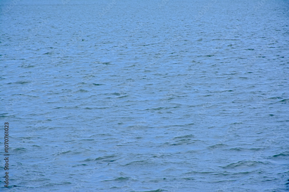 Deep blue rippling water surface. Deep blue rippling water surface.