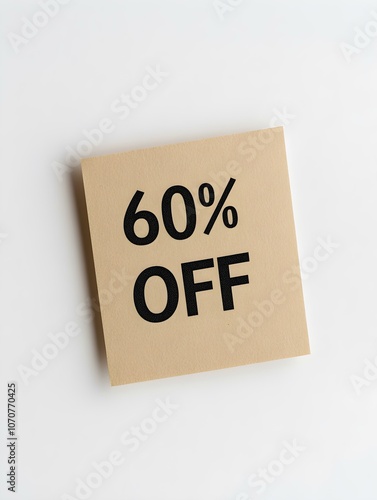 Black '60% OFF' Text on a Light Brown Square Paper Note. White Background 