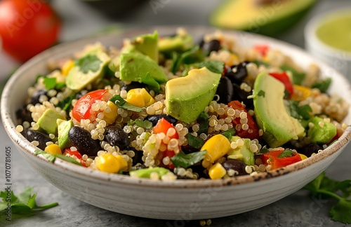 Vegetarian quinoa salad with black beans, corn and avocado.