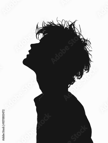 Man with short hair is silhouetted against a white background. Concept of loneliness and introspection, as the man is looking up at something or someone