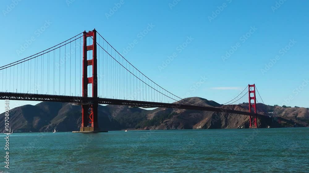 Witness the breathtaking beauty of the Golden Gate Bridge as the sun rises, illuminating its vibrant red structure against the calm waters and hills of San Francisco. Witness the breathtaking beauty of the Golden Gate Bridge as the sun rises, illuminating its vibrant red structure against the calm waters and hills of San Francisco.