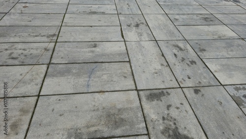 weathered Concrete Floor Tiles with Urban Texture photo