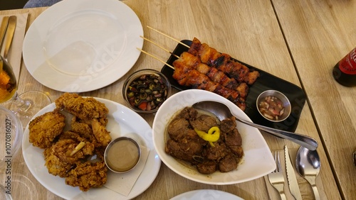 Filipino Feast with Fried Chicken, Grilled Skewers, and Liver Adobo photo