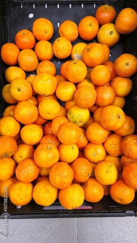 Fresh Oranges on Display at Local Market photo