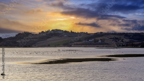 Spring in Norway, sunset at Trondheim fjord and river Gaula photo