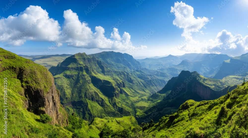 Fototapeta premium A stunning view of the Simien Mountains in Ethiopia, with dramatic cliffs and valleys under a bright blue sky.