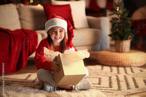 Cute little girl in Santa h...