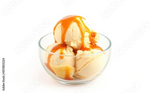 A bowl of vanilla ice cream topped with caramel sauce, a sweet treat perfect for a hot summer day