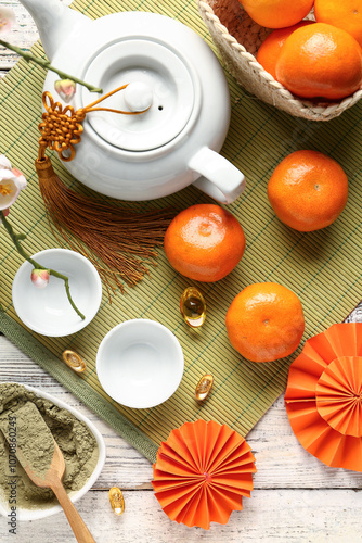 Teapot with mandarins, bowl...