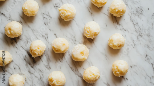 A close up of a marble countertop with a bunch of small, round photo