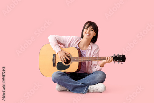Pretty young woman playing ...