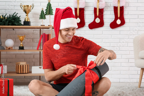 Young happy man in Santa ha...
