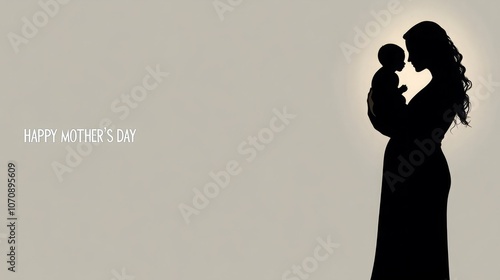 A silhouette of a mother holding her baby, a touching image for Mother's Day.