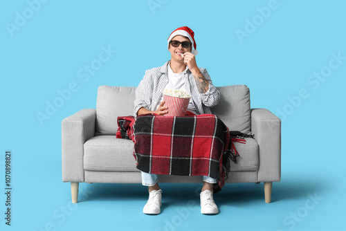 Young man in Santa hat with...
