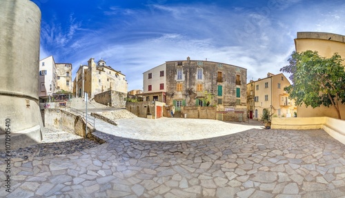 Fototapeta Naklejka Na Ścianę i Meble -  Scene from the historic old town of Calvi in Corsica with cobblestone streets and rustic buildings