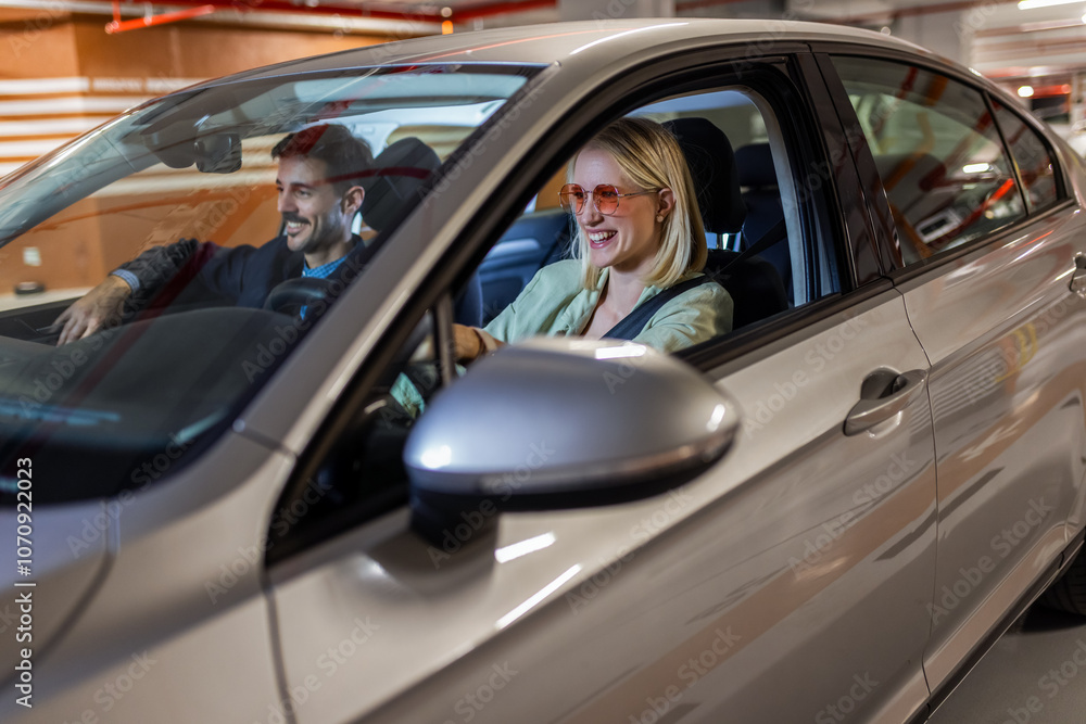 Happy energetic couple drives around in the car. They smile and sing. Happy energetic couple drives around in the car. They smile and sing.