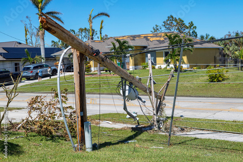 Wallpaper Mural Fallen power lines agist the backdrop of a damaged home cape coral Torontodigital.ca