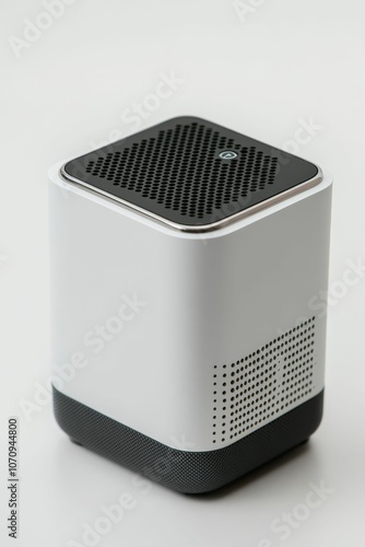 White speaker with black mesh grille.