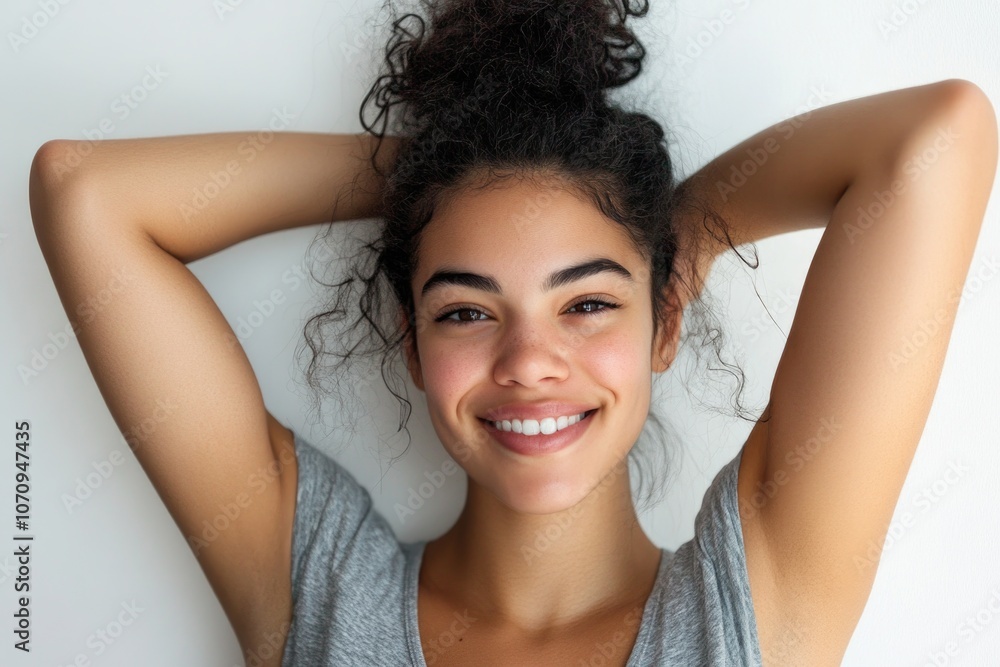 A calm and relaxed woman sitting or standing with her hands behind her head, ready to take on the day A calm and relaxed woman sitting or standing with her hands behind her head, ready to take on the day