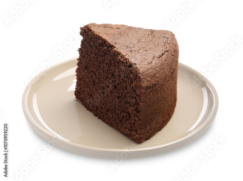 Plate with piece of chocolate sponge cake isolated on white