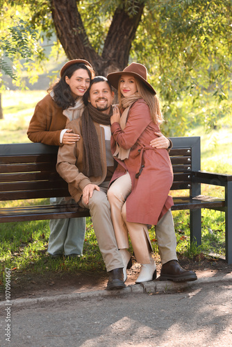 Man with two beautiful wome...