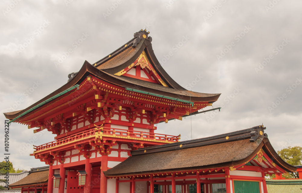 Fototapeta premium Fushimi Inari Taisha - Kyoto’s Iconic Shrine of Thousand Torii Gates. Taken in Japan, Kyoto, 04.2024.